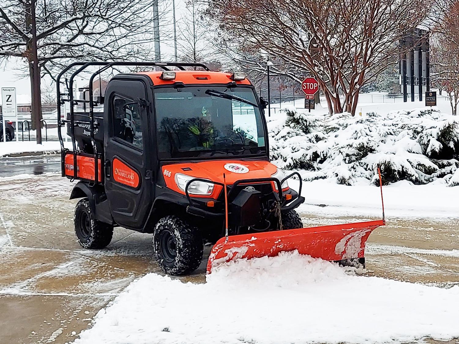 Small Plow clearing walkway of snow