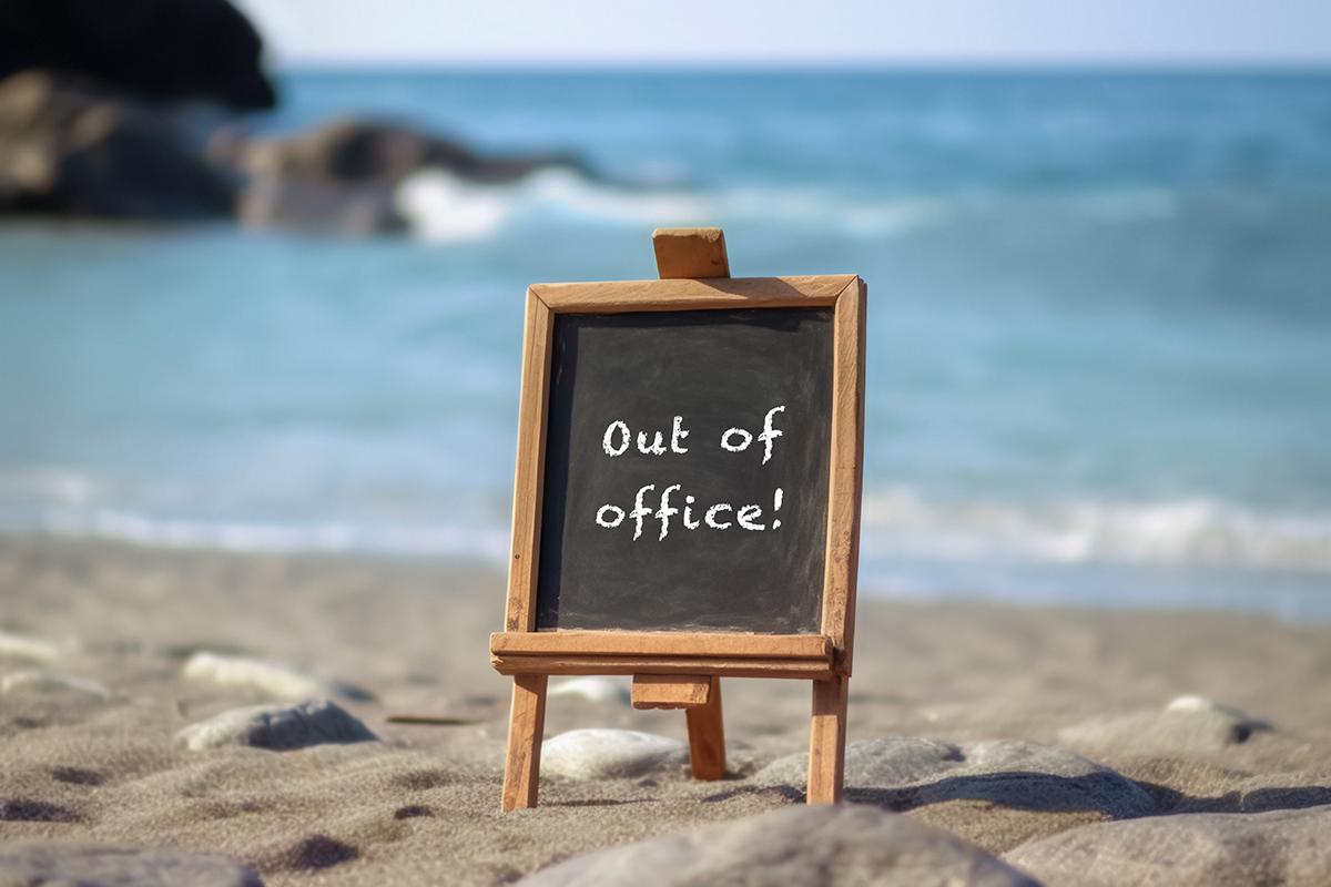 Out of Office sign on beach